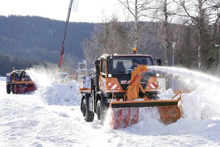 Mercedes Unimog with snow clearing attachment