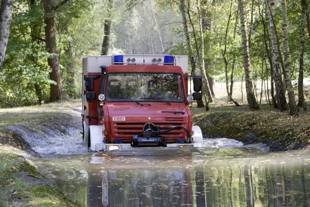 Mercedes Unimog fire engine fording deep water Mercedes Unimog fire engine fording deep water