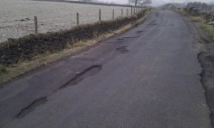 Potholes UK rural road