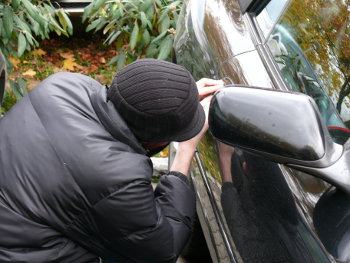 Thief stealing a car