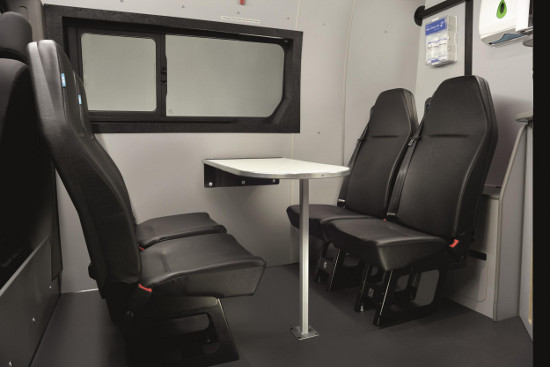Welfare van travel-safe seating with table