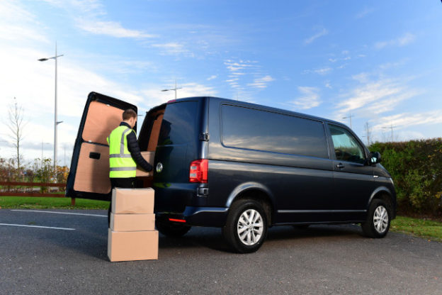 Man loading boxes into van